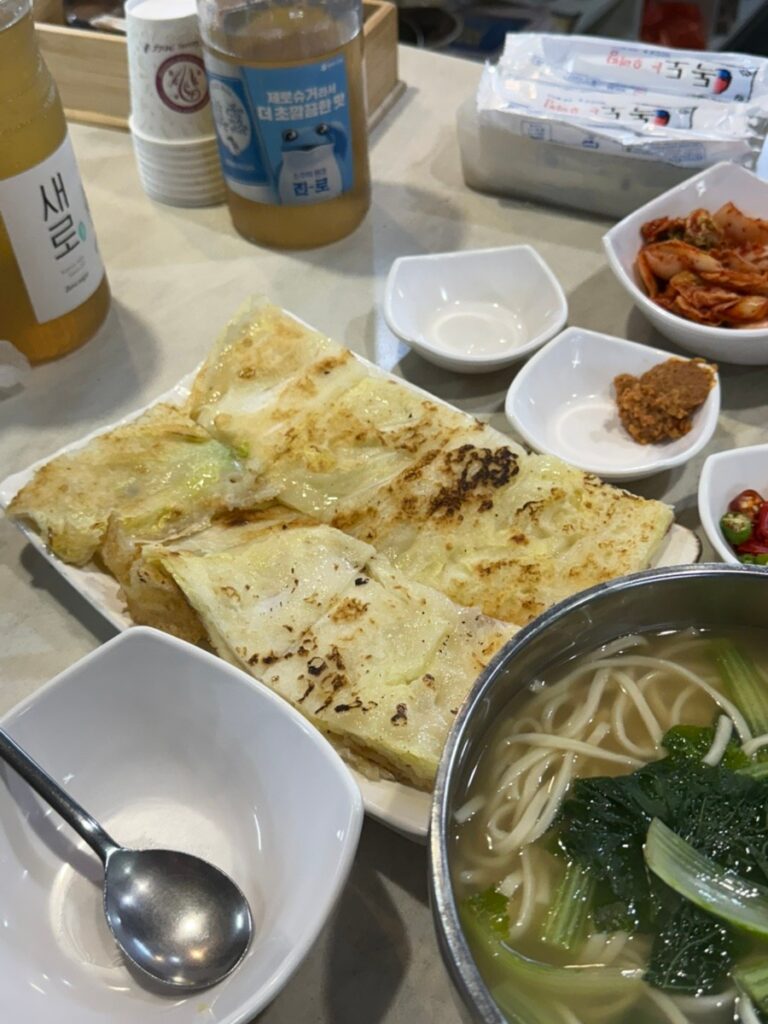 Handmade noodle soup and cabbage pancake at Andongjip in Gyeongdong Market