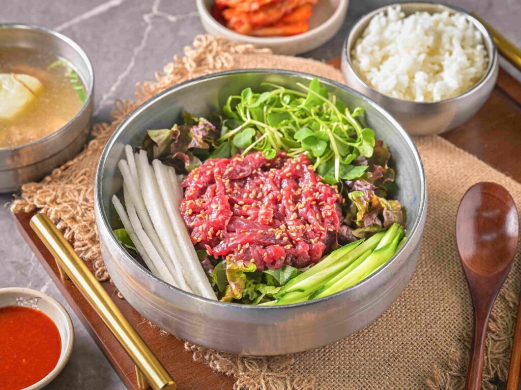 Raw beef yukhoe bibimbap at Buchon Yukhoe in Gwangjang Market Seoul