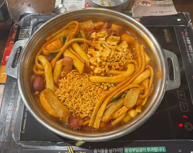 Custom tteokbokki cooking at Dookki Myeongdong Station in Seoul