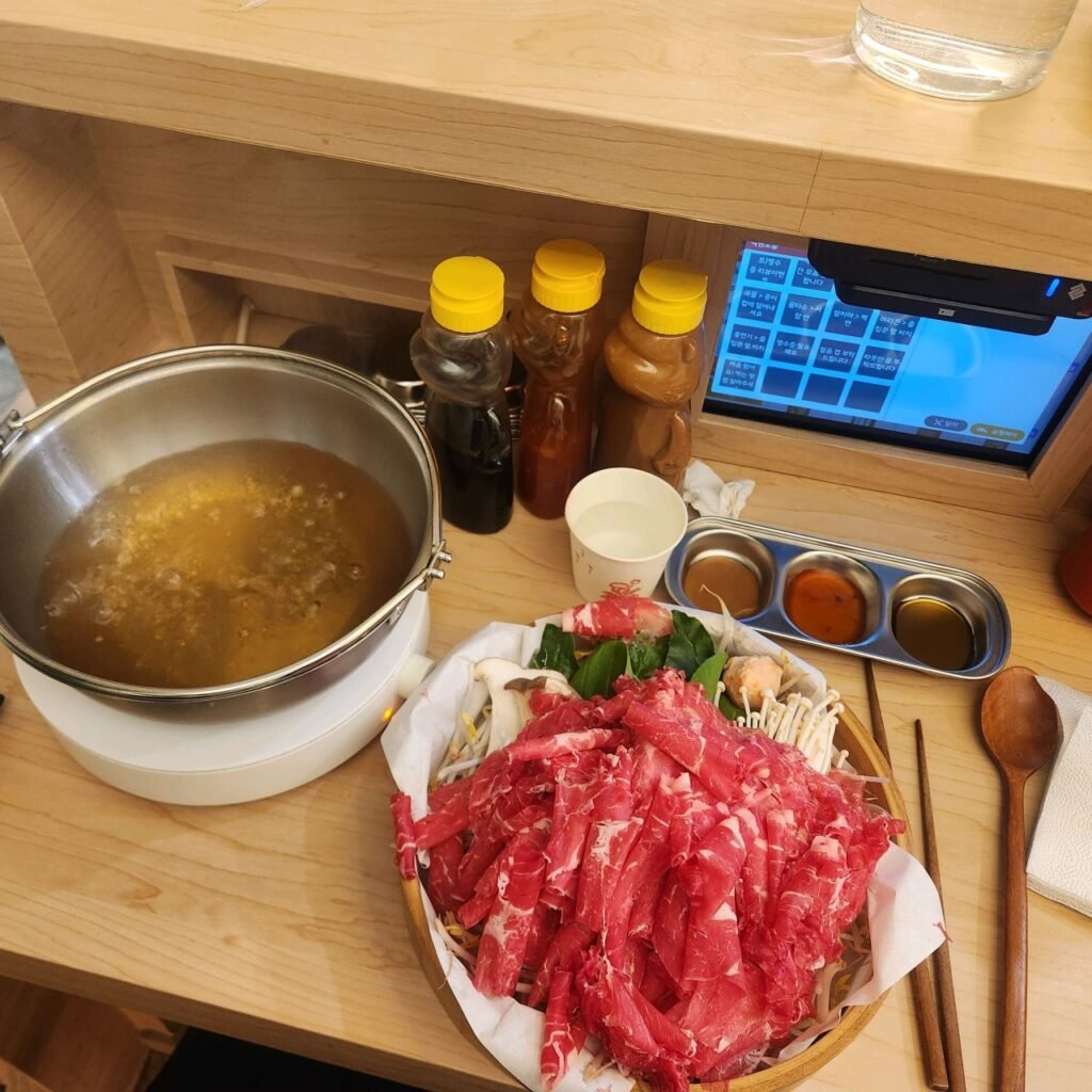 One-person shabu-shabu setup with an individual pot at Eondeok in Hongdae