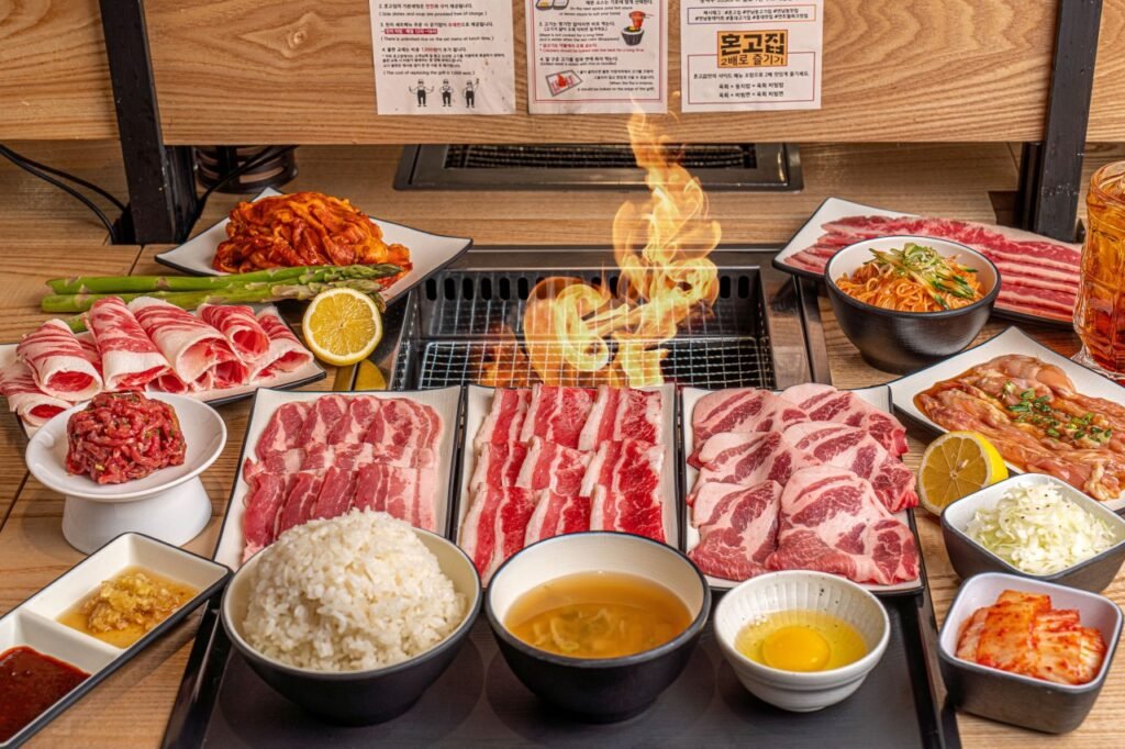 Individual Korean BBQ grill with assorted meats at Hongojib Myeongdong