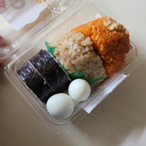 Korean convenience store breakfast with triangle gimbap sandwich and coffee