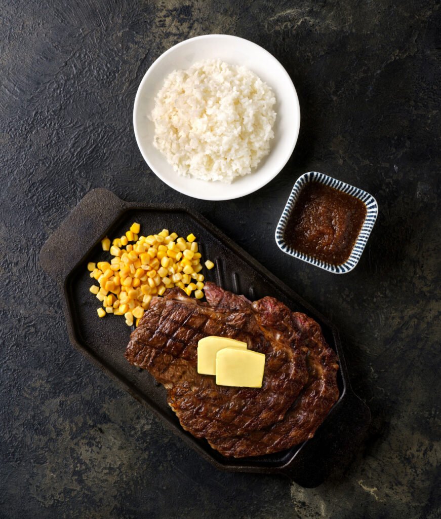 Grilled steak with rice and corn at Macho Steak in Seoul