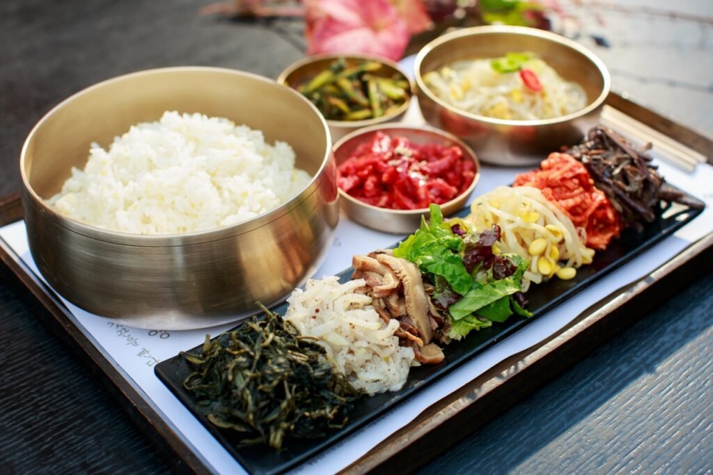 Bibimbap meal with rice and assorted Korean vegetables at Mokmyeoksanbang