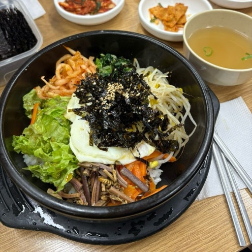 Regular bibimbap and hot stone pot dolsot bibimbap served in Seoul