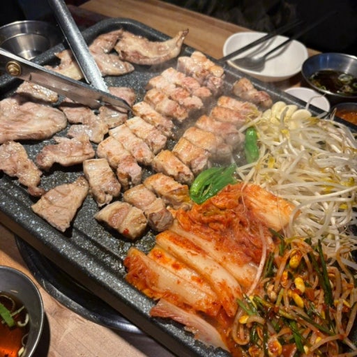 Samgyeopsal and moksal grilling at Korean BBQ in Myeongdong