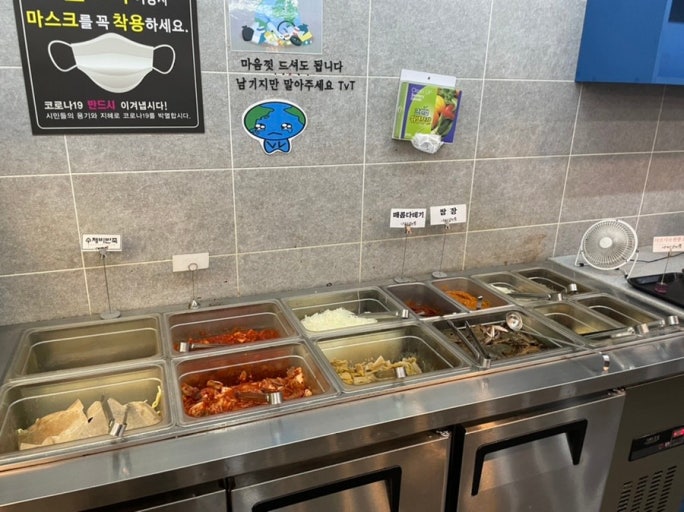 Self-service water and utensil station at a Korean restaurant