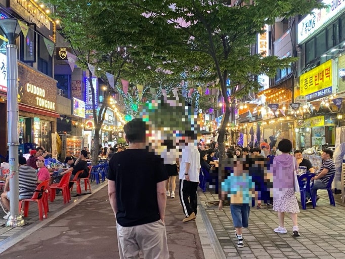 Seoul restaurant street with Korean BBQ signs in the evening