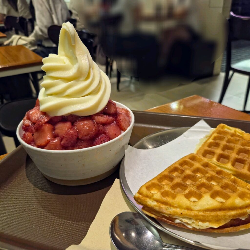 Strawberry bingsu served with a warm butter and jam waffle in Seoul