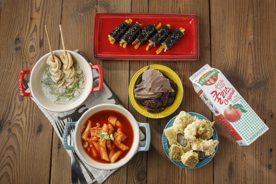 Tteokbokki with fried snacks and fish cakes at a Korean bunsik restaurant in Seoul