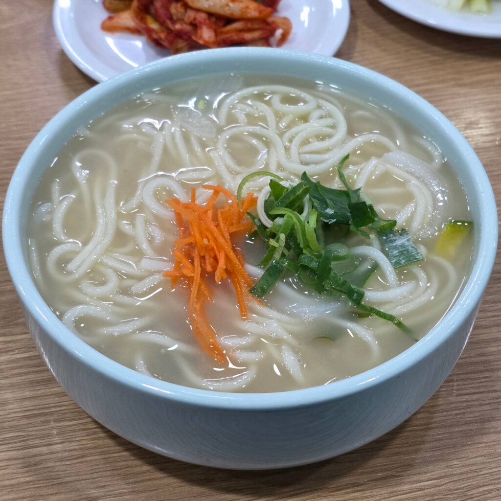 Rich beef-bone kalguksu at Yeonhuidong Kalguksu in Seoul