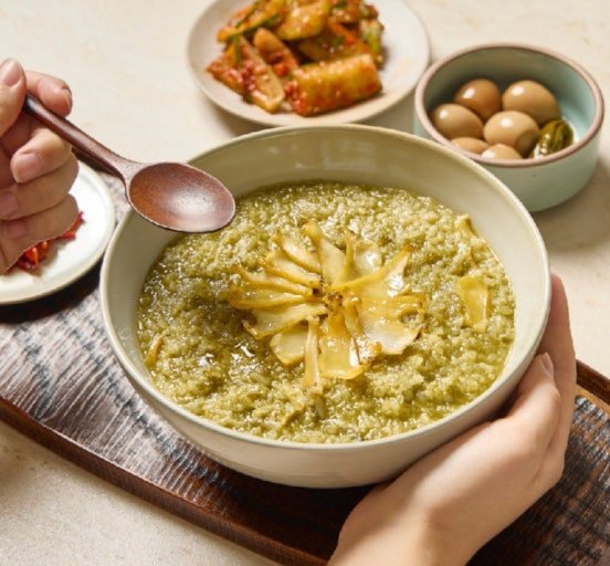 Korean juk rice porridge served with side dishes in Seoul