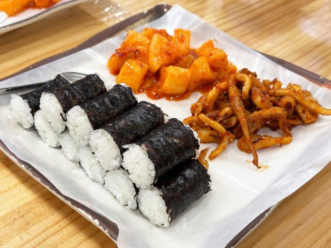 Chungmu gimbap with spicy squid and radish kimchi in Myeongdong Seoul